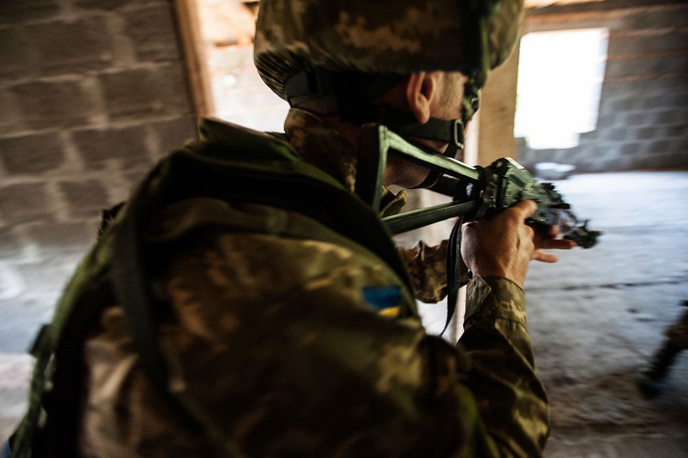 A Ukrainian marine clears a room during a situational training exercise as part of Rapid Trident 2014 in Yavoriv, Ukraine…