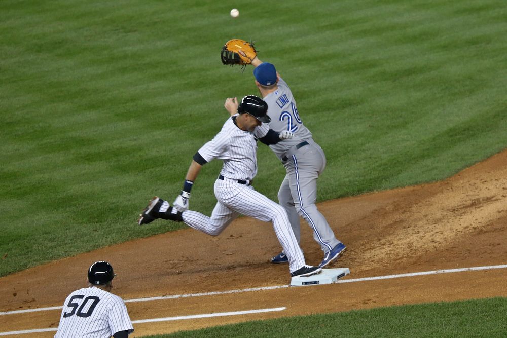 New York Yankees shortstop Derek Jeter outruns a throw to first base at Yankee Stadium on Sept. 18, 2014.