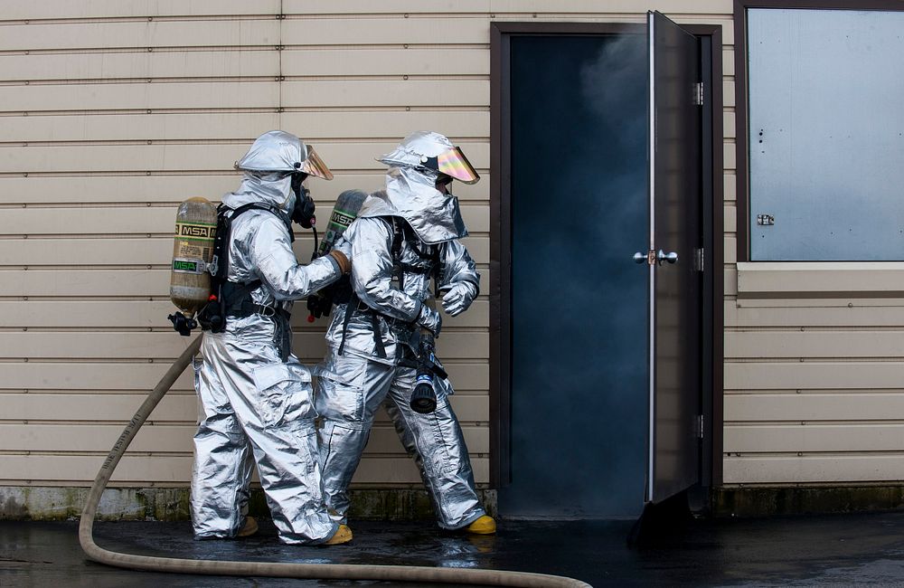 U.S. Air Force firefighters enter a building during a controlled fire exercise at Ramstein Air Base, Germany on Mar. 19…
