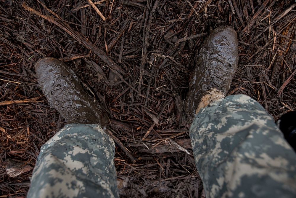 Muddy soldier in training exercise. Original public domain image from Flickr
