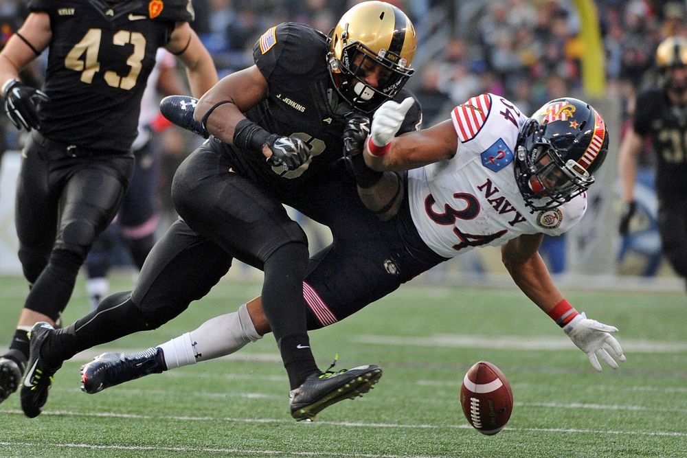 Navy&rsquo;s Noah Copeland attempts to catch a pass that was broken up by Army&rsquo;s Josh Jenkins during the 115h Army…