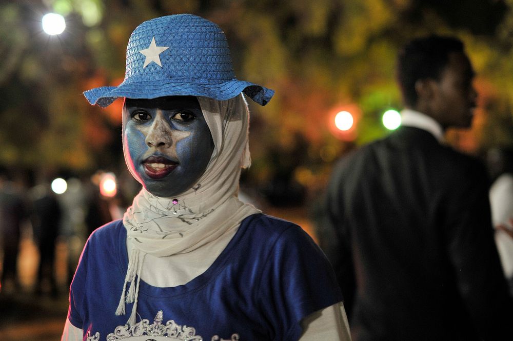 A young Somali woman, her face painted with her country's flag, attends an independence day celebration in Mogadishu…