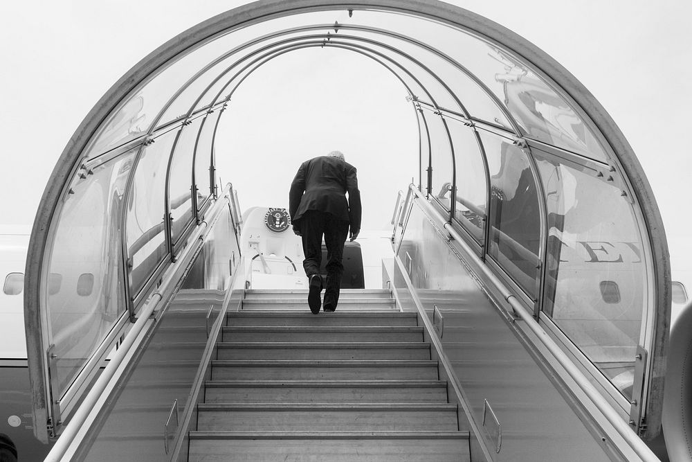 Secretary Kerry Climbs the Stairs to Airplane for a Flight to Geneva After Leading U.S. Delegation to President Buhari's…