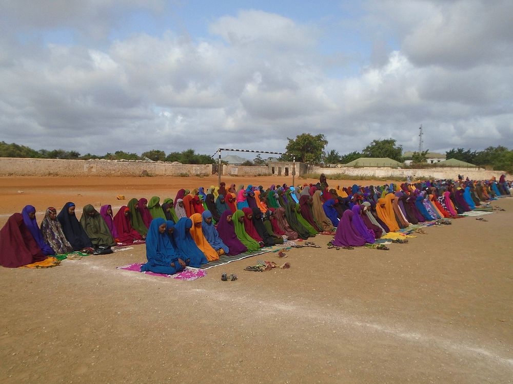 Residents of Baidoa pray at the stadium during the celebrations to mark Eid Al-Fitri in Somalia on July 17, 2015. AMISOM…