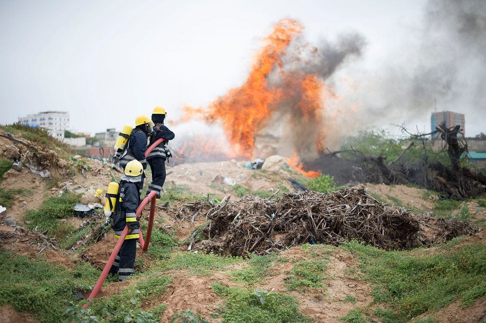 Somali aviation fire fighters demonstrate skills during a fire fighting drill in Mogadishu, Somalia on July 14 2015.