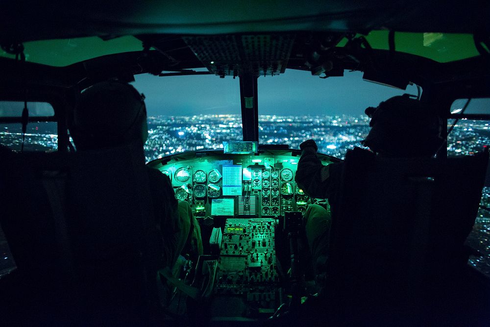 (Right to left) Capt. Brandon Jones and 1st Lt. Jonathan Palka, 459th Airlift Squadron UH-1N Iroquois pilots, use night…