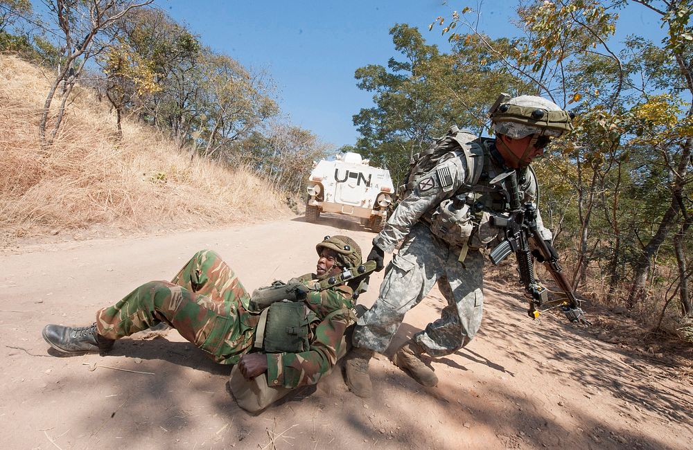An U.S. Army Soldiers pull a simulated wounded member of the Zambian Defense Force out of harms way during an exercise at…