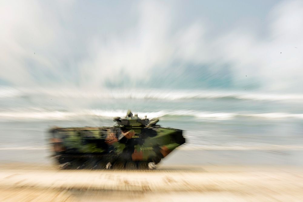 A U.S. Marine Corps Assault Amphibious Vehicle participates in a beach assault demonstration as Secretary of Defense Ash…