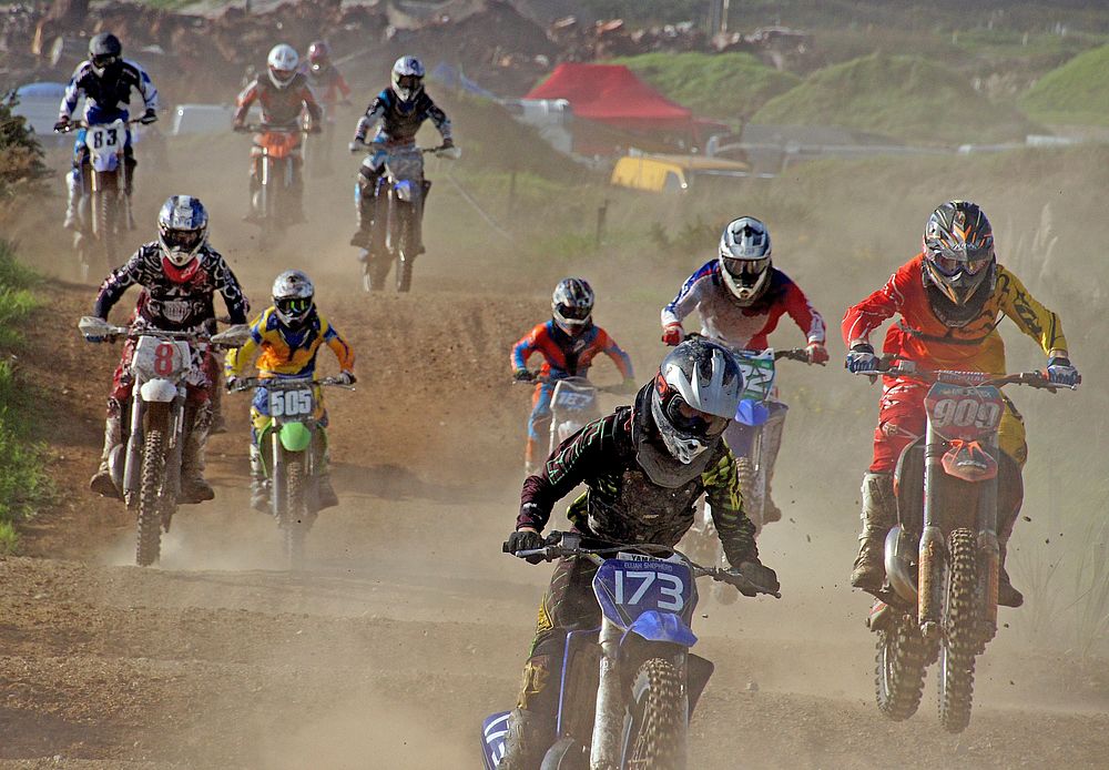 Dirt bike riders at a motocross race. Original public domain image from Flickr