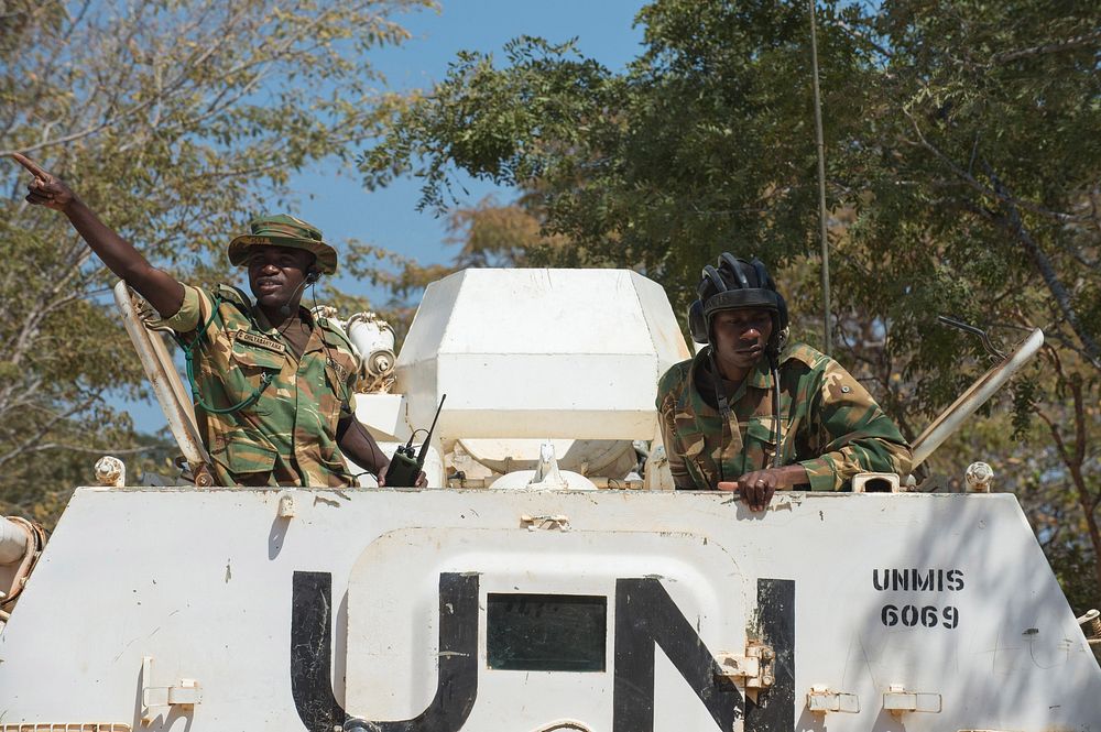 Soldiers with the Zambian Defense Force communicate with ground troops from a United Nations vehicle during a simulated…