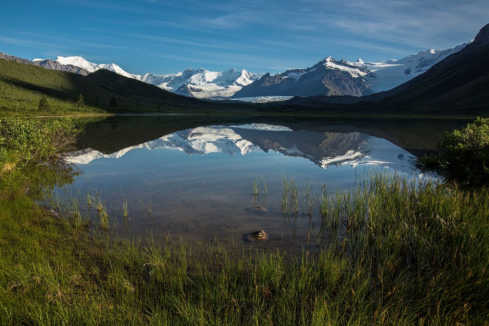 Lake with snowy mountain view. Original public domain image from Flickr