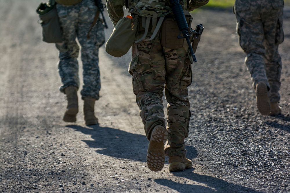 Rifle Military Biathalon U.S. Army Reserve International Combat Team competitors jog the final stretch of a 7-kilometer…