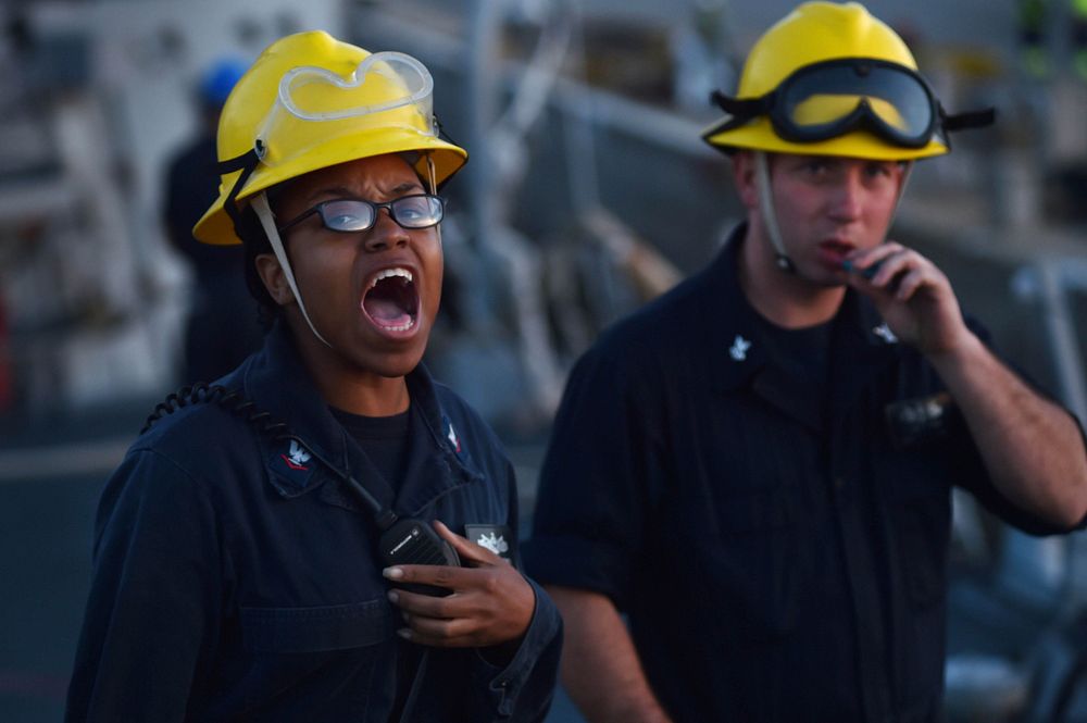 ROTA, Spain (Oct. 26, 2015) Boatswain's Mate 3rd Class Kernishia Jones shouts orders as petty officer in charge during sea…