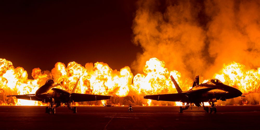 Ring of Fire. Two FA-18 Jets are displayed in front of the Wall of Fire during the Marine Corps Community Services sponsored…