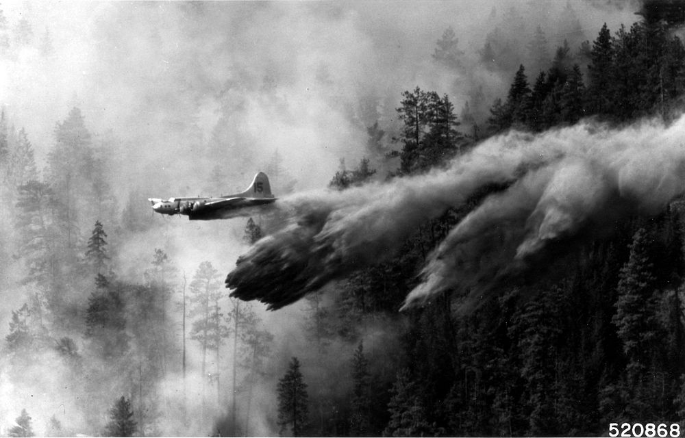 Old B-17 Air Tanker Dropping Retardent on Fire, c1960. Original public domain image from Flickr