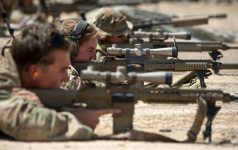 U.S. Army Alpha Company, 3rd Battalion, 15th Infantry Regiment, scout snipers fire M110 sniper rifles Oct. 14, 2015, at…