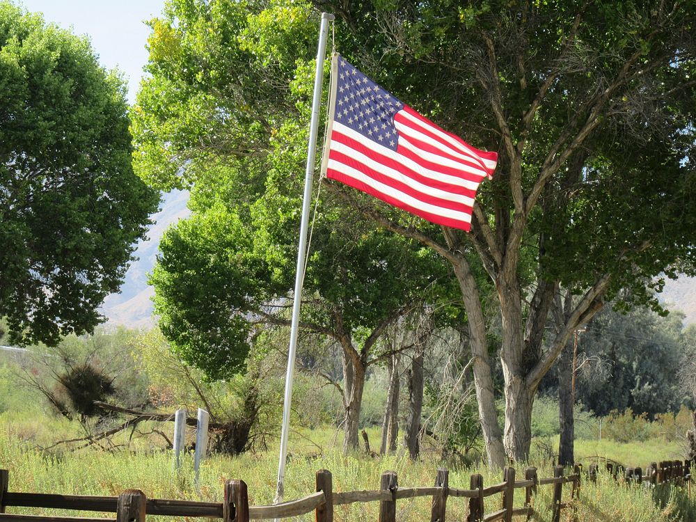 US flag in the countryside. Original public domain image from Flickr