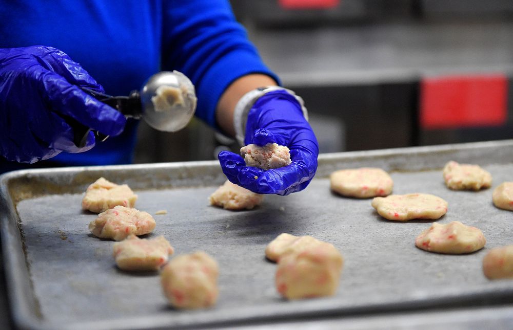 Cookie CrushVolunteers bake thousands of cookies utilizing the Wolf's Den dining facility kitchen on Joint Base Elmendorf…