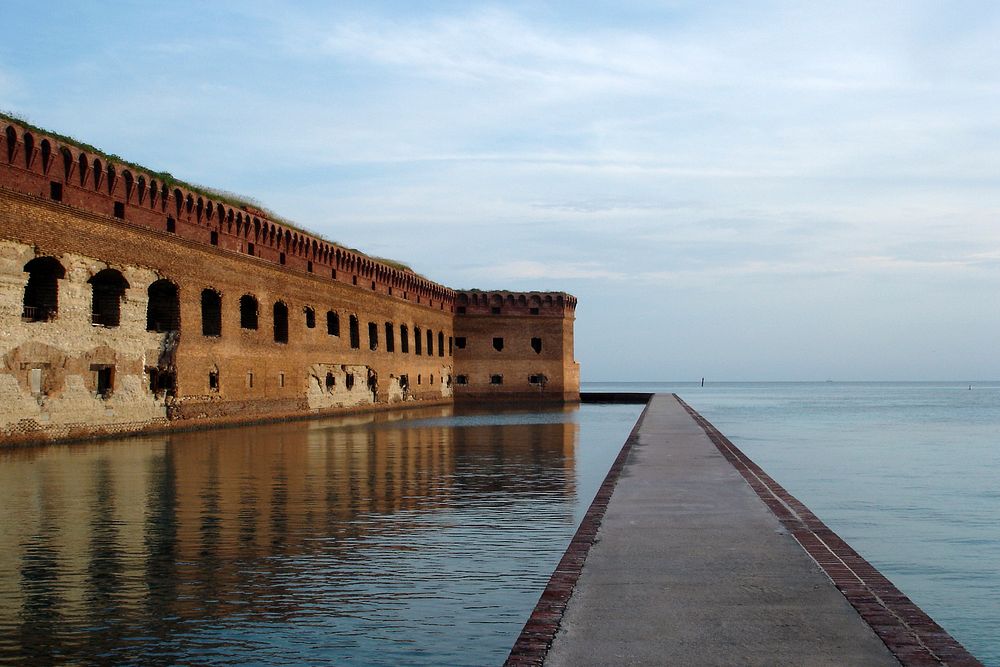 Fort Jefferson moat and wallThe Gulf of Mexico laps against the moat wall protecting Fort Jefferson. Original public domain…