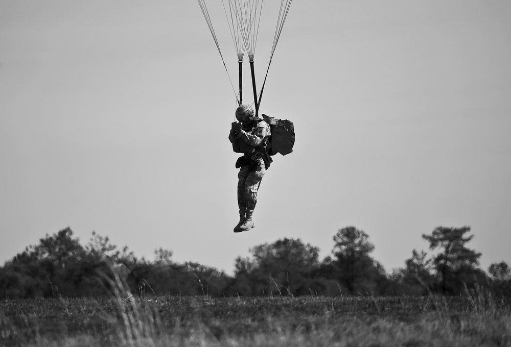 A U.S. Army Reserve paratrooper prepares to hit the ground during airborne operations at Coyle Drop Zone, Joint Base McGuire…