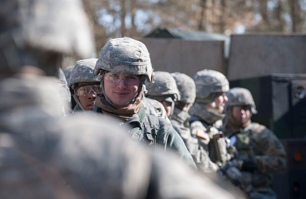 A group of U.S. Army Soldiers wait for a medical supplies briefing rifle during the demonstration portion of the U.S. Army…