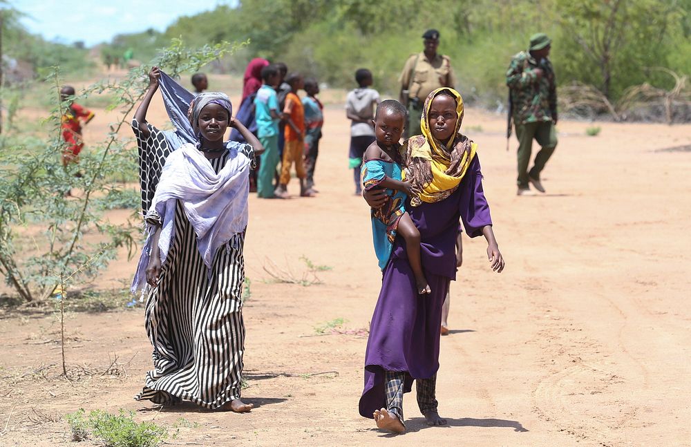 At the Dadaab refugee complex in north-eastern Kenya, refugee children walk along a roadside path on 12 April 2018.