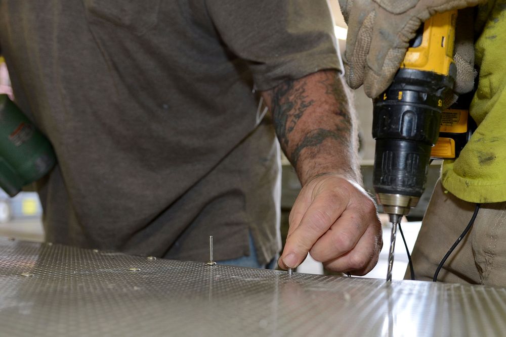 Civilian construction workers perform renovations on the South Carolina Air National Guard’s Enclosed Noise Suppression…