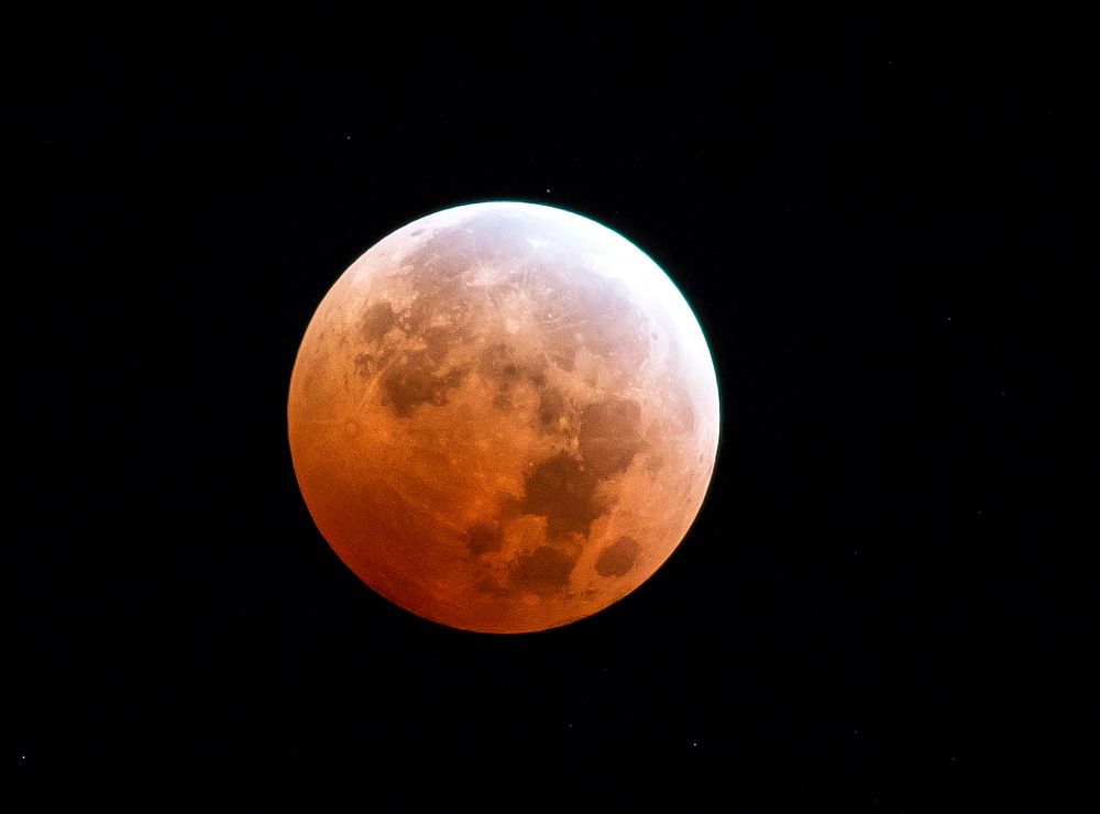 Super blood moon on black background. Original public domain image from Flickr