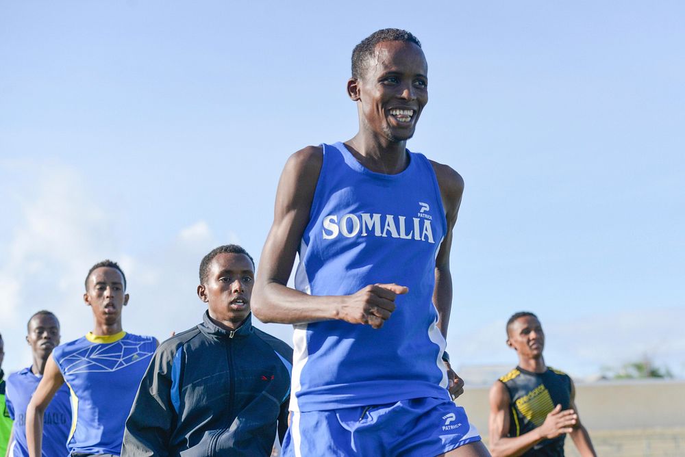 Mohamed Daud Mohamed, Somalia's representative at the Rio Olympics, leads other athletes during training at Banadir Stadium…