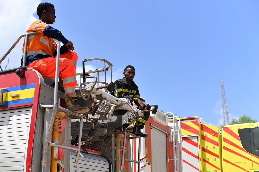 Members of the Mogadishu's Fire and Emergency Response Service serving under the Benadir Regional Administration, atop a…