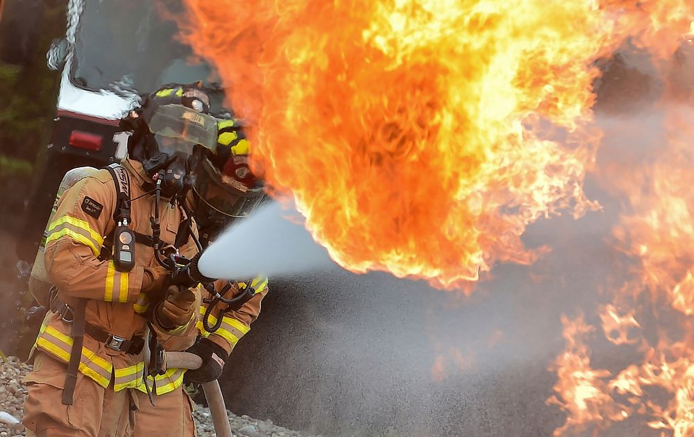 Fire protection specialist Airmen assigned to the 673rd Civil Engineer Squadron perform firefighter training on a simulated…