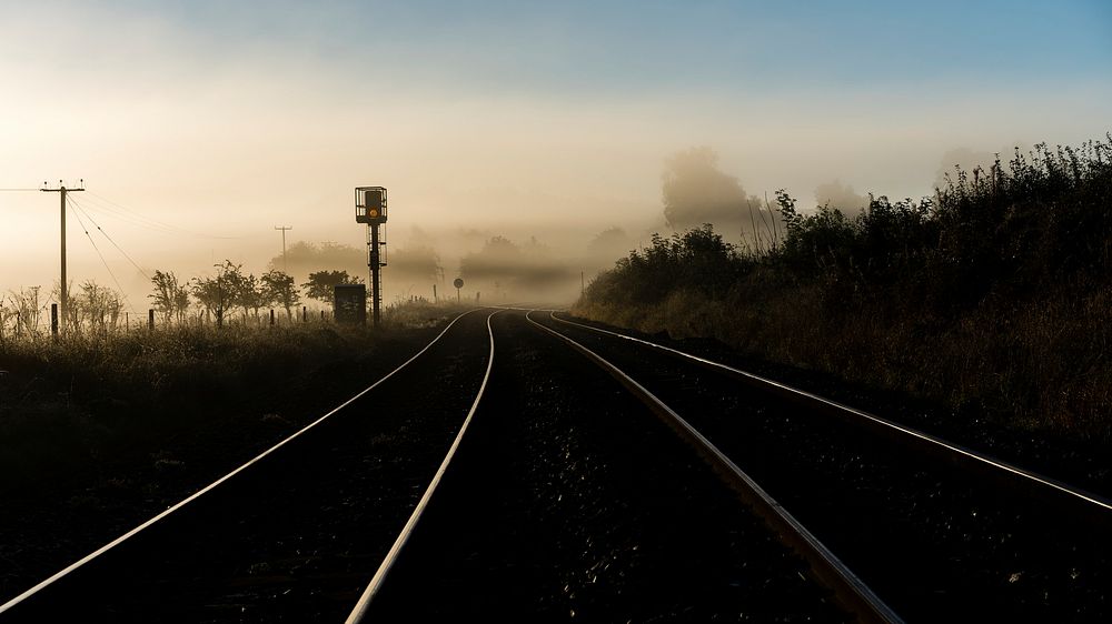 Misty morning with railroads. Original public domain image from Flickr