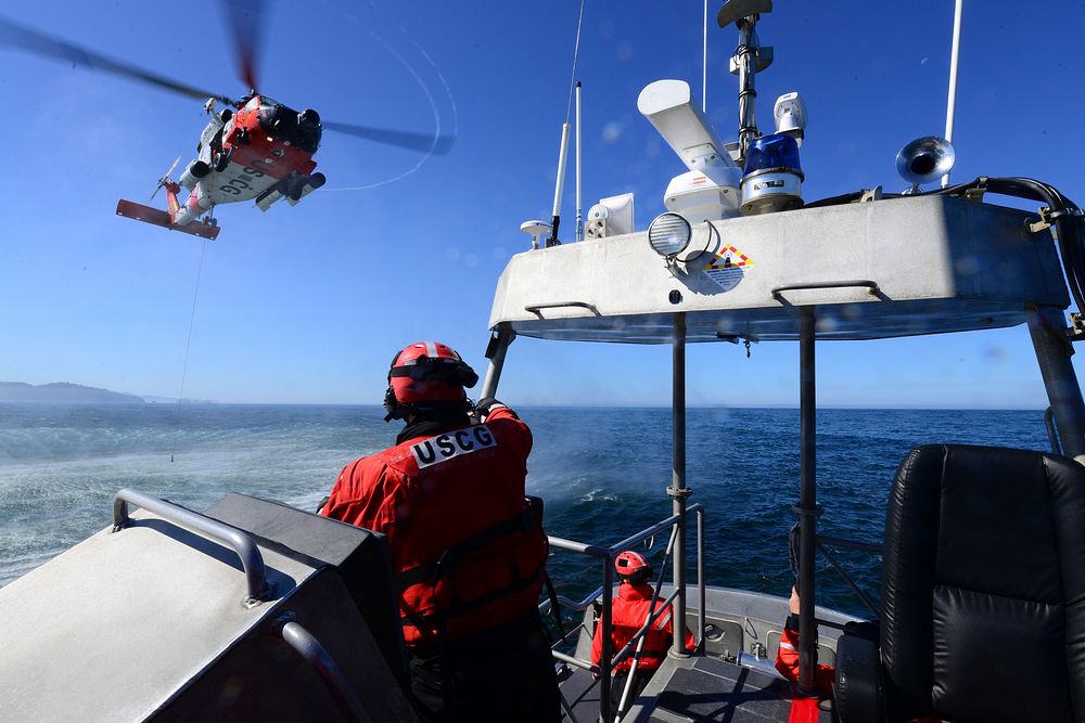 An MH-60 Jayhawk helicopter crew approaches a 47-foot Motor Lifeboat from Station Tillamook Bay during a training evolution…
