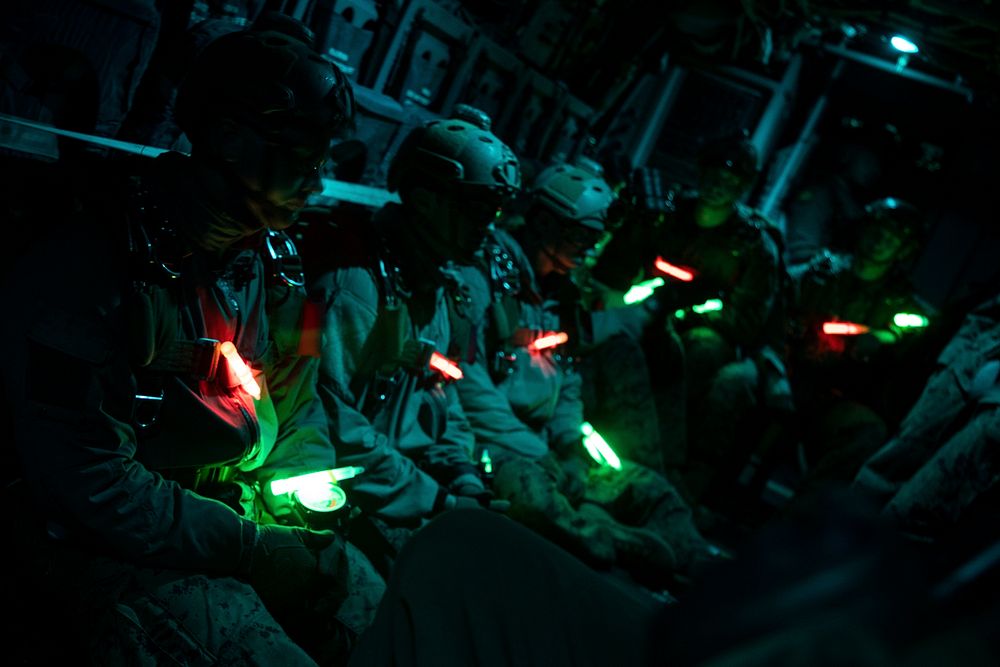 U.S. Marines with the Maritime Raid Force, 22nd Marine Expeditionary Unit, standby to perform free-fall parachute operations…