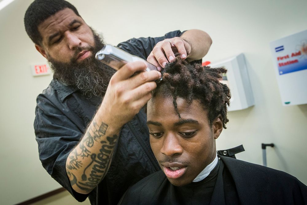A New Jersey Youth ChalleNGe Academy Class 49 candidate has his hair cut during in-processing at the Joint Military and…