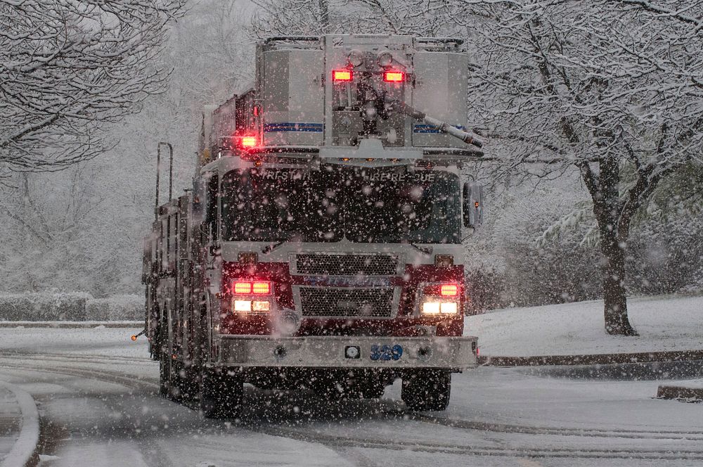 Fire truck in snowy road. Original public domain image from Flickr