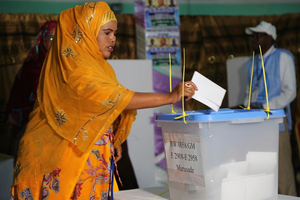 A delegate casts her vote during the electoral process to choose members of the Lower House of the Federal Parliament in…