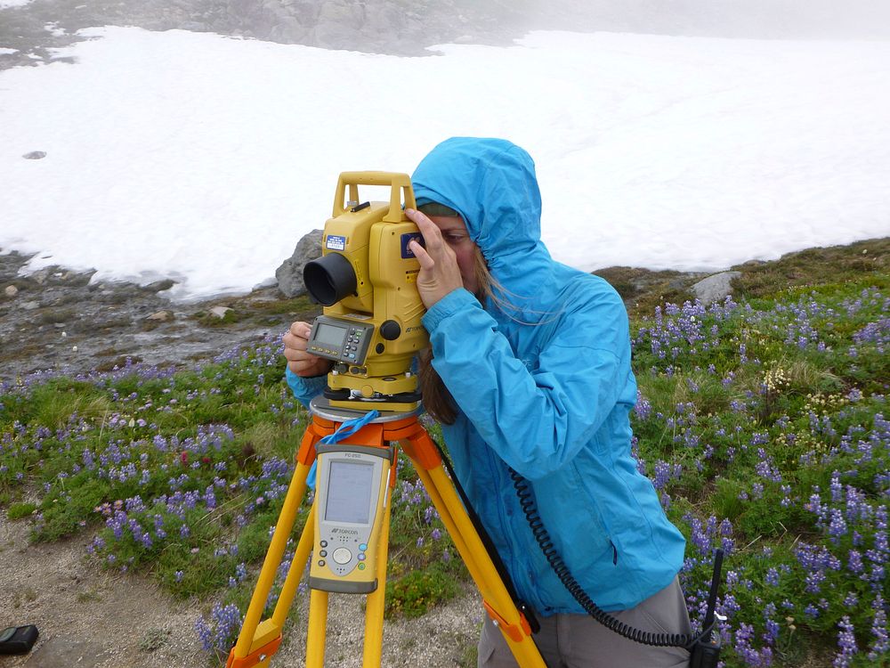 Anna Stifter, GIP intern surveying the Nisqually Glacier at Mount Rainier National Park, Washington. NPS photo by…