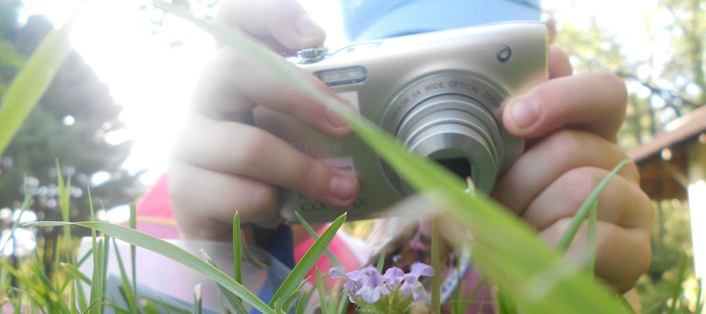 Close up of student taking SNAP! photoLooking at nature through the lens of a camera