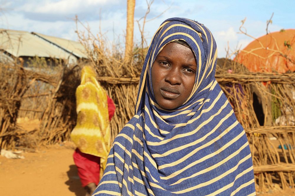 Hawa Aden Issak stands in front of her house at Kormari Camp for the Internally displaced Persons in Baidoa, Somalia on…