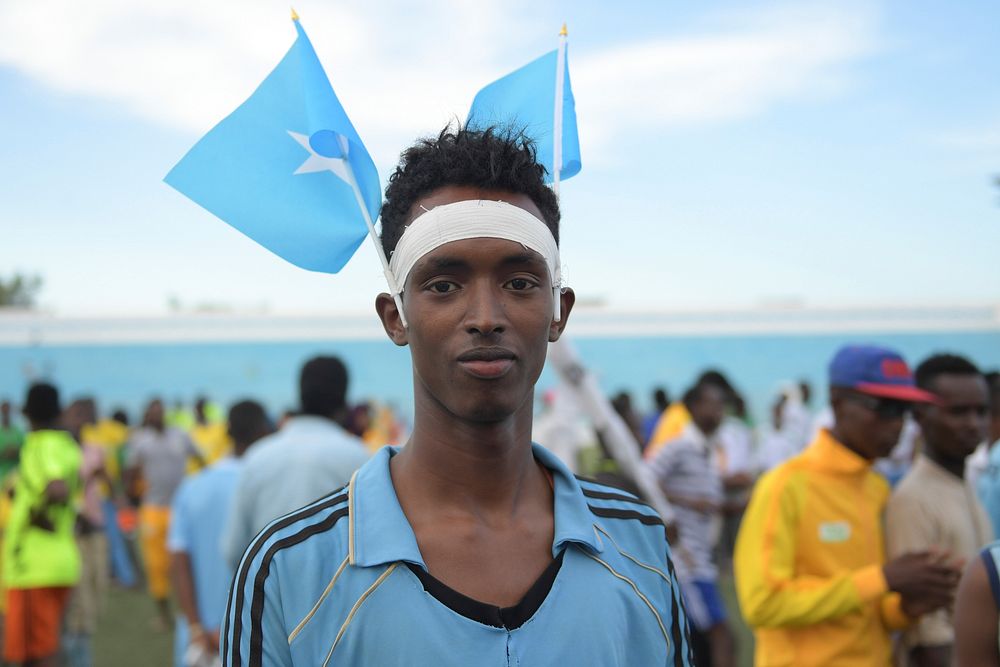 A youth with Somali flag on his head at a ceremony to mark International Sports Day for development and peace in Mogadishu…