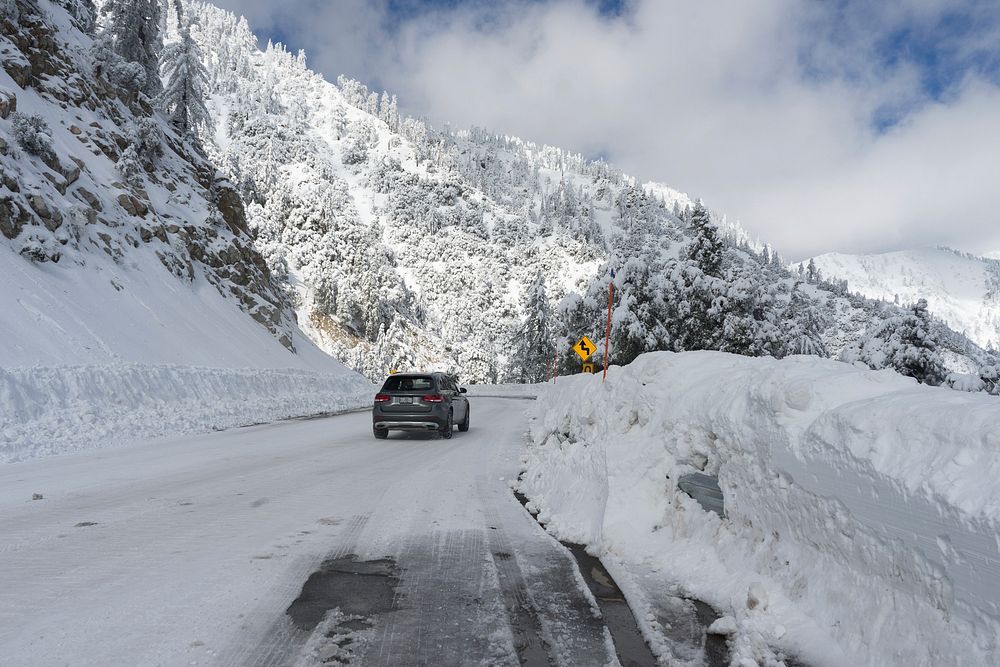 A portion of highway 18 covered in snow after a storm.Forest Service photo by Tania C. Parra. Original public domain image…