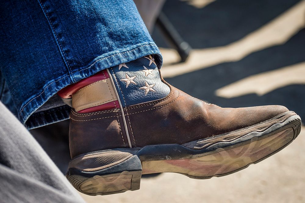 Iowa Senator Joni Ernst wears boots with the American flag during Agriculture Secretary Sonny Perdue visit to Nevada, Iowa…