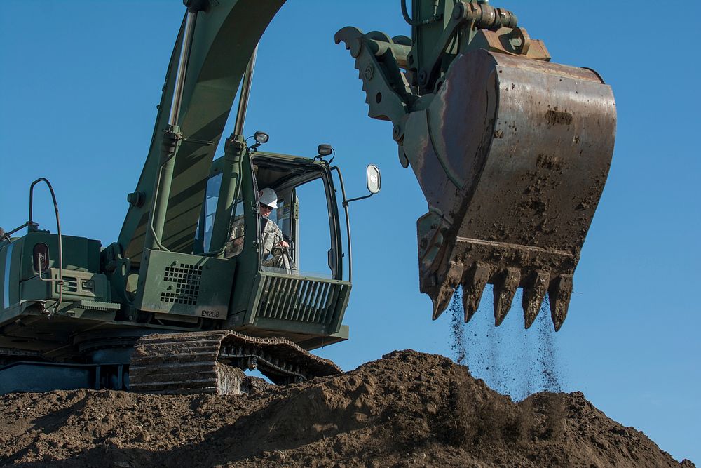 US soldier using excavator. Original public domain image from Flickr