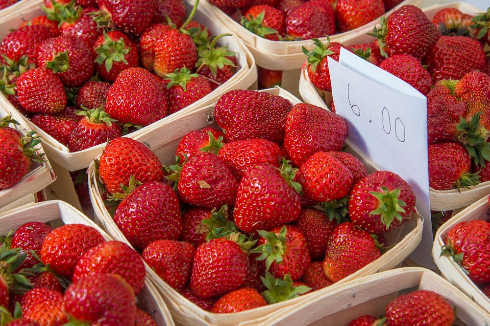 Vender strawberries at the U.S. Department of Agriculture (USDA) farmers market at the USDA headquarters in Washington…