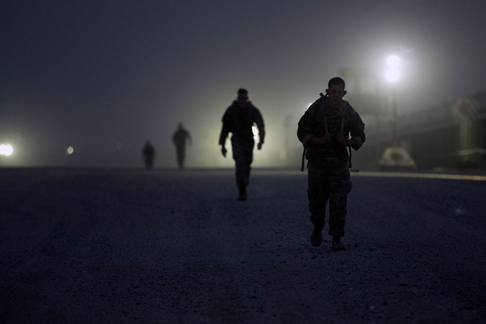 U.S. Soldiers ruck during the ruck-march portion of the German Armed Forces Badge qualification at Camp Arifjan, Kuwait…