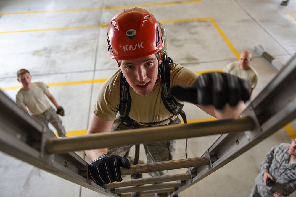 U.S. Air Force Academy Cadet 2nd Class Ryan Ramseyer climbs a ladder during a fire training challenge at Kunsan Air Base…