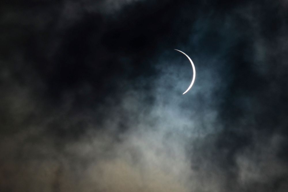 Partial solar eclipse with smoke. Original public domain image from Flickr