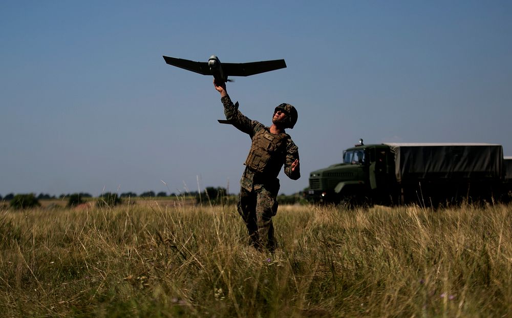 MYKOLAYIVKA, Ukraine (July 19, 2017) A U.S. Marine with Black Sea Rotational Force 17.1 launches an unmanned aerial vehicle…