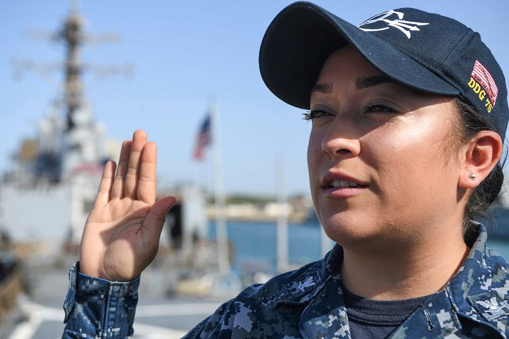 NAVAL STATION ROTA, Spain (Aug. 23, 2017) Personnel Specialist 3rd Class Maria Arreolaaguilar, from Dallas, reenlists aboard…